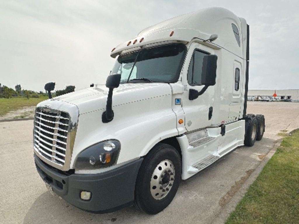 Truck cab exterior of a 2019 Freightliner Cascadia125 conventional sleeper, white with sleeper cab, dual rear axles, front grille, and side steps visible.