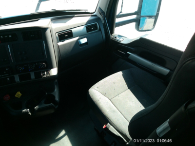 Kenworth T680 truck cabin interior showing dashboard and passenger seat area.
