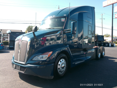 Kenworth T680 truck in blue, front-left view, with sleeper cab and dual rear axles, VIN sticker location visible.