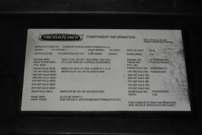Freightliner component information plate on 2017 Cascadia 125 showing model PXT25S4T? with various axle and paint details, including Meritor axle specs and BUS numbers.
