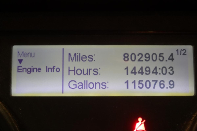 Dash display showing Miles: 802905.4 1/2, Hours: 14494:03, Gallons: 115076.9 and Menu Engine Info on left