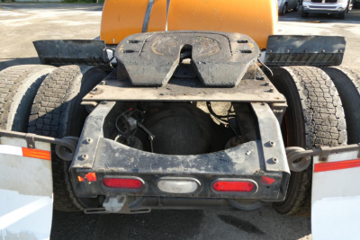 Rear view of a Volvo VNM42T truck showing the fifth wheel and rear chassis with dual tires.