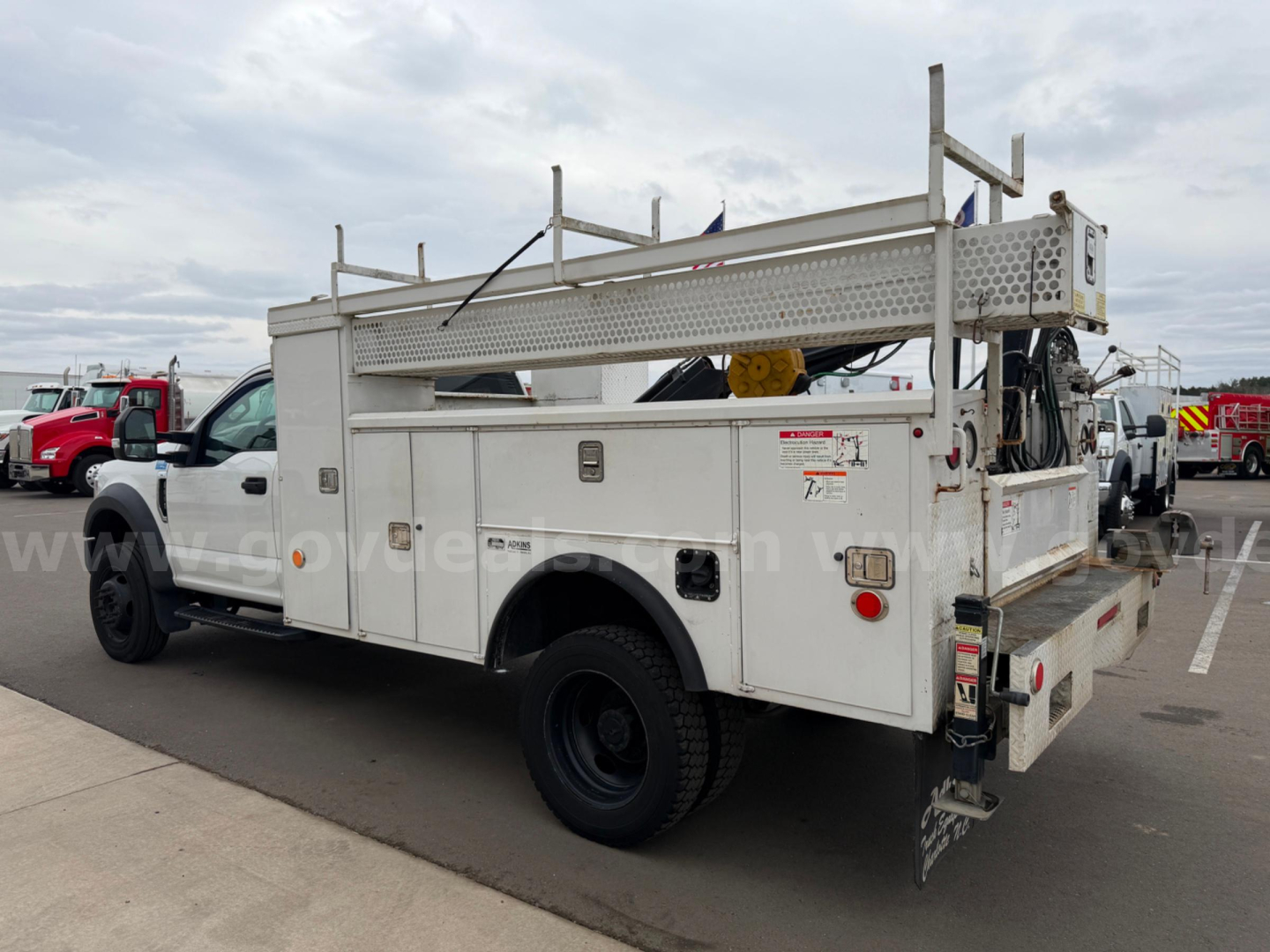 Service/utility truck bed side view 2019 Ford F-550 utility service body with ladder rack and compartments