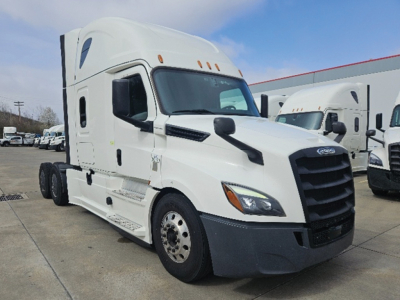 Truck cab showing Freightliner Cascadia 126 with white paint, front grille, and side mirrors.