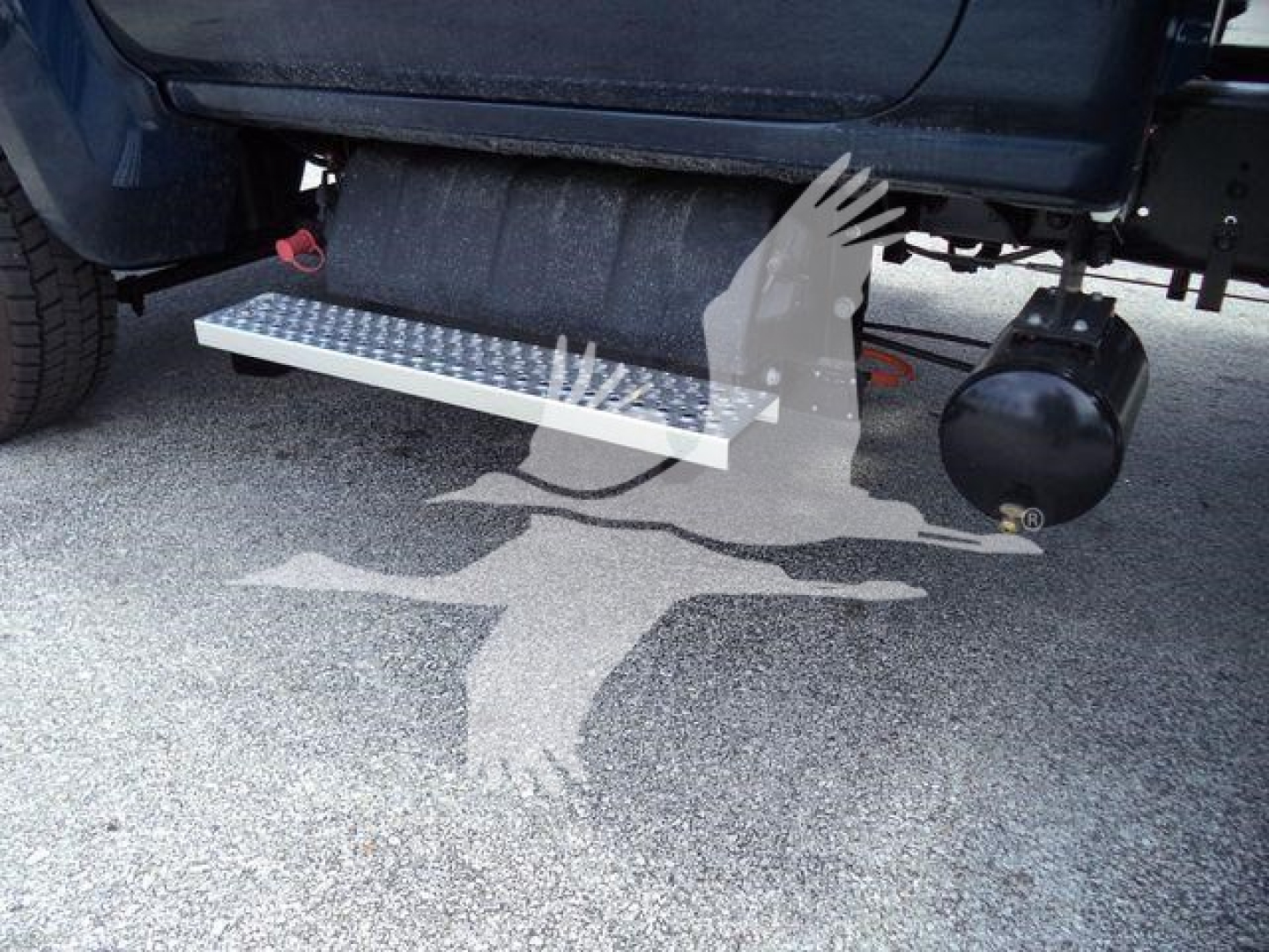 Chevrolet Silverado 6500HD truck side view showing aluminum side step with diamond tread and underbody components