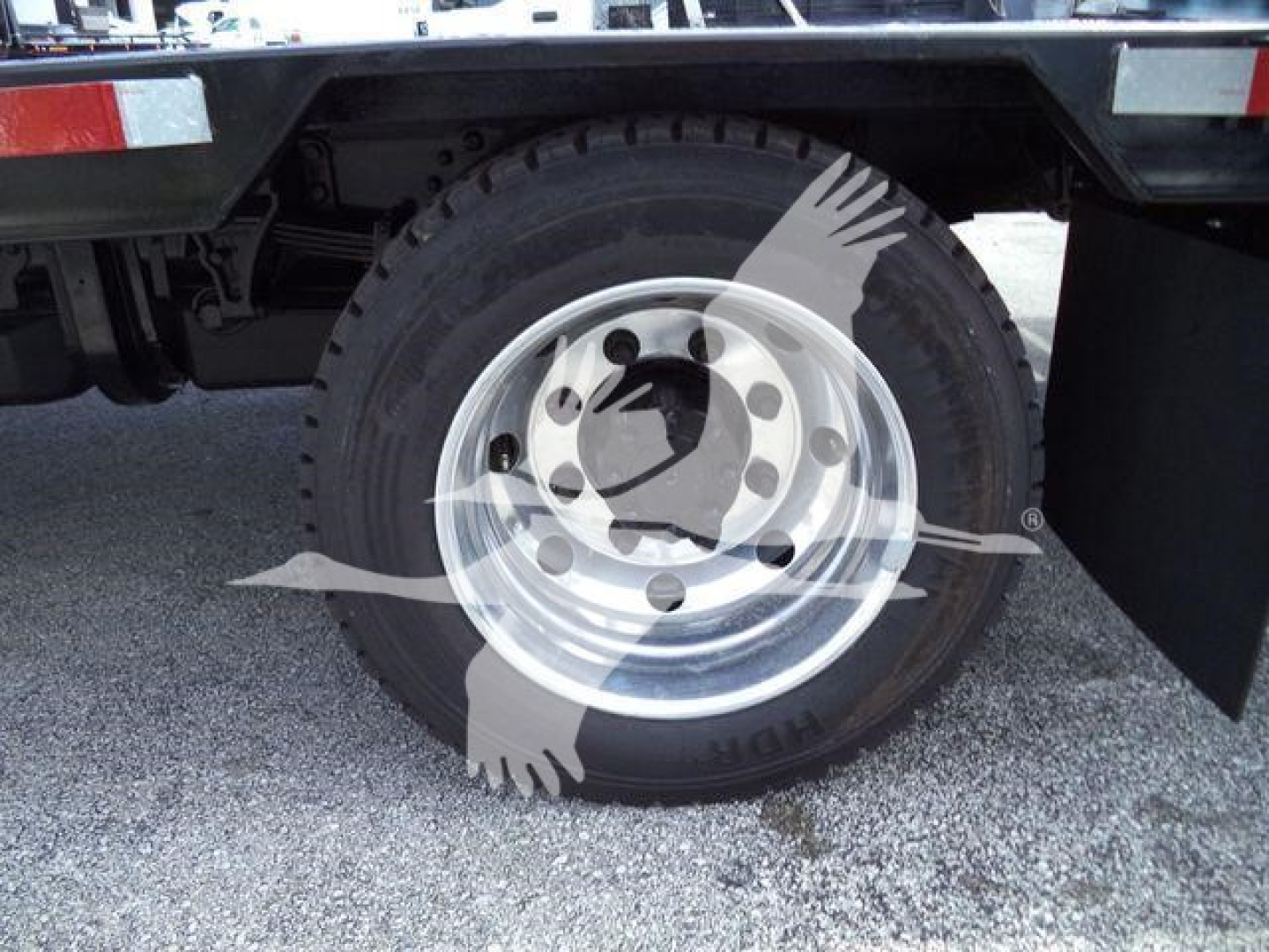 Wheel and tire on the rear of a Chevrolet Silverado 6500HD chassis cab showing steel wheel and heavy-duty tire.