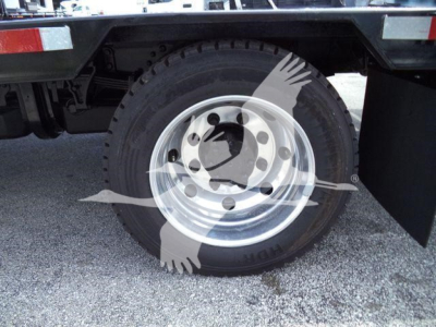 Wheel and tire on the rear of a Chevrolet Silverado 6500HD chassis cab showing steel wheel and heavy-duty tire.