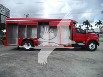 Ford F650 medium-duty truck in side view with red cab and open-sided cargo compartments, blank shelves, beverage category listing