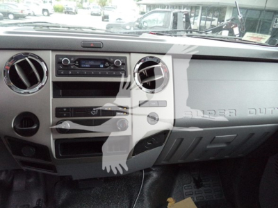 Ford F-Series dashboard showing radio, circular AC vents, and glove compartment on 2021 Ford F650 Sd interior