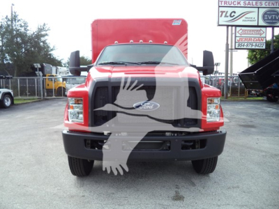 Front view of a red 2021 Ford F650 SD truck showing front grille, headlights, bumper; dealership lot background.