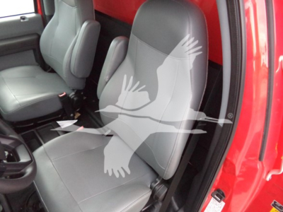 Interior of a 2021 Ford F650 cab showing front seats and center console.