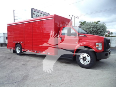Truck front-right view of a red 2021 Ford F650 SD box truck with enclosed cargo area and white wheels.