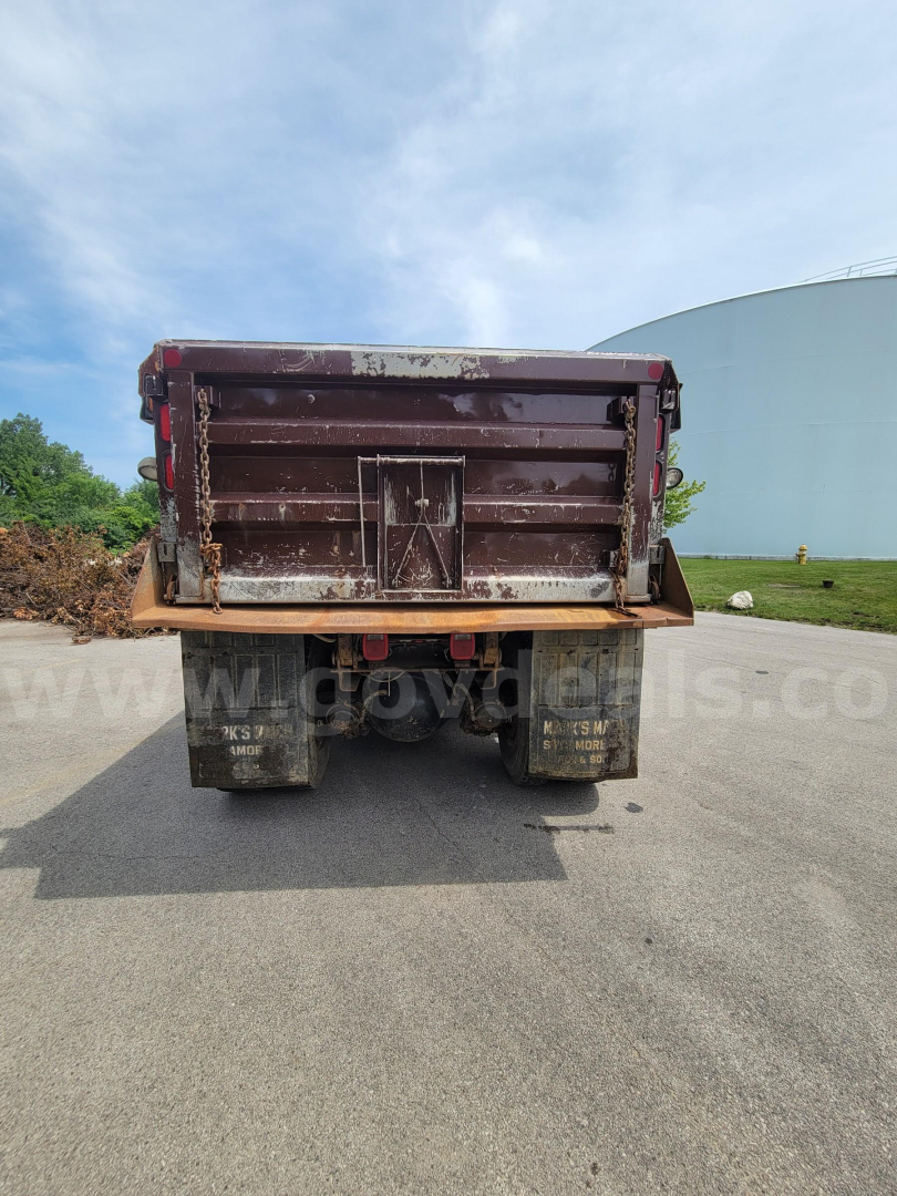 Dump truck bed of a 2008 International 7400 viewed from rear showing tailgate and chassis.