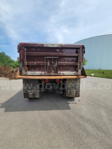 Dump truck bed of a 2008 International 7400 viewed from rear showing tailgate and chassis.