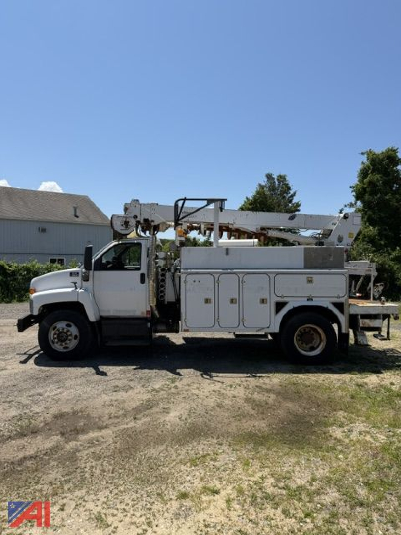 Digger truck side view showing utility body with multiple storage compartments and an elevated boom lift.