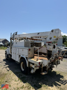 GMC C8500 digger truck rear view showing boom and utility compartments