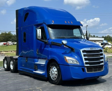 Freightliner Cascadia 126 sleeper cab truck in blue, front three-quarter view