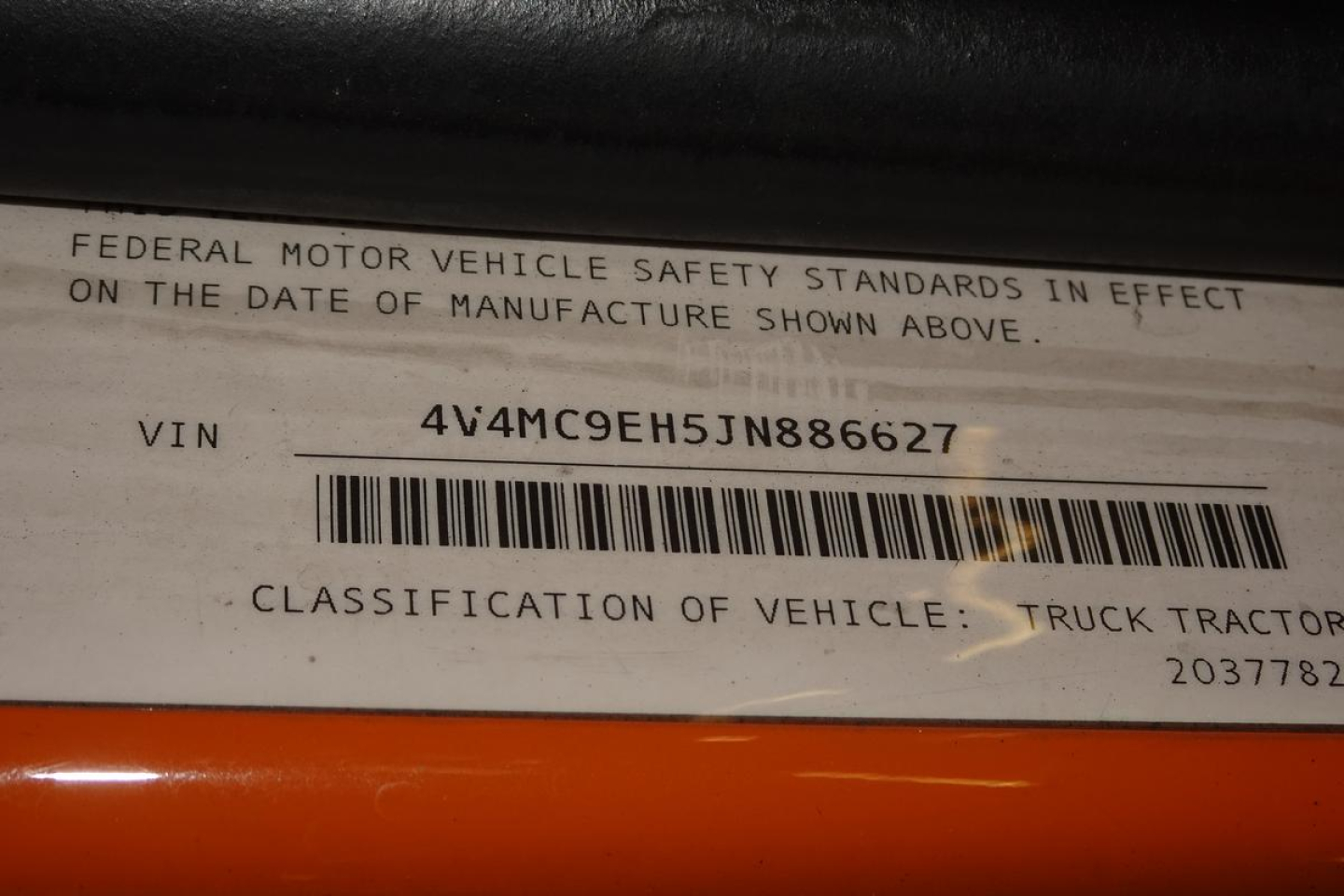Federal Motor Vehicle Safety Standards label with VIN 4V4MC9EH5JN886627 and bar code, classification line, and a partial date text.