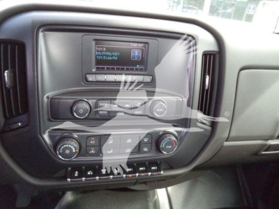 Chevrolet Silverado 6500HD dashboard center console with touchscreen infotainment and control knobs.