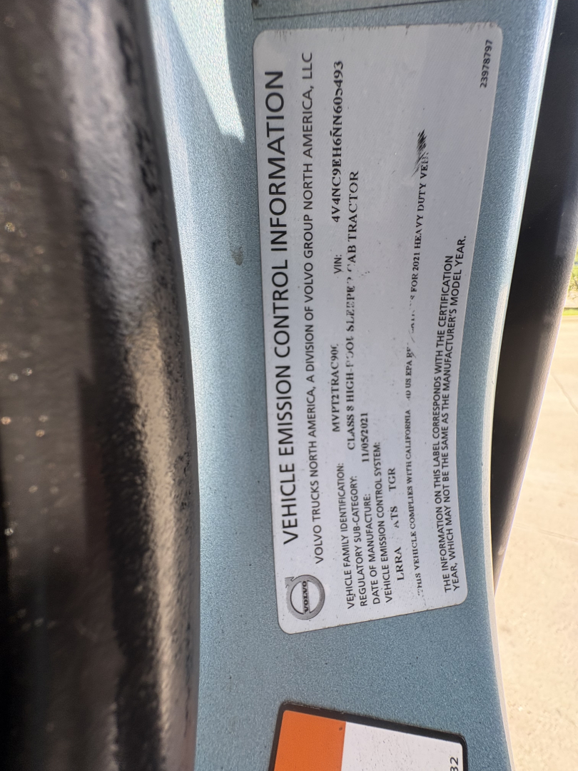 Vehicle information label on a Volvo truck door frame with VIN and control information visible.