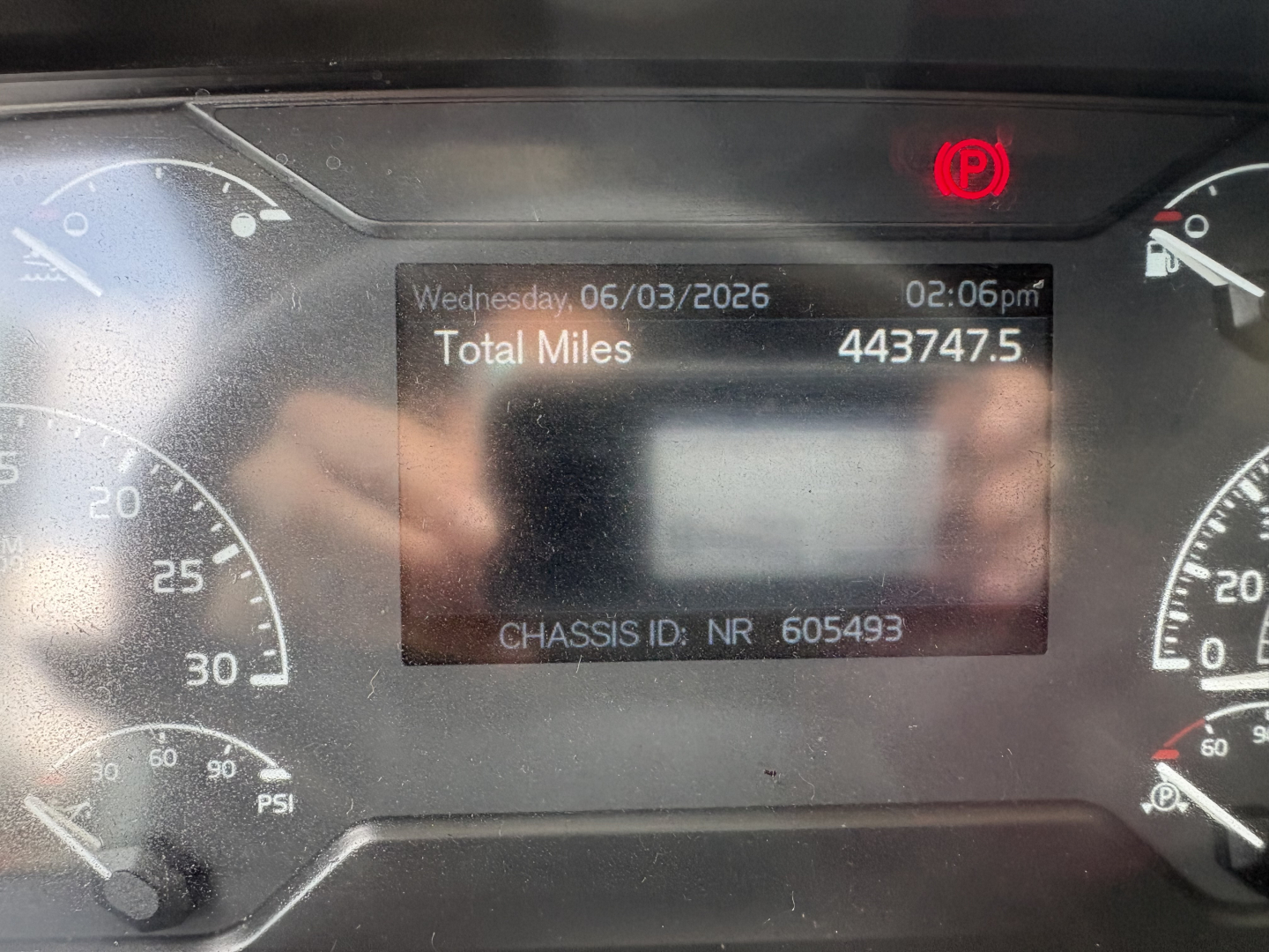 Truck dashboard display showing total miles 443747.5, date Wednesday 06/03/2026, time 02:06pm, chassis ID NR 605493.