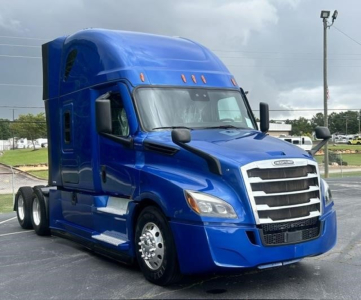  Freightliner Cascadia 126 blue semi-truck cab in view, front grille, sleeper, and dual rear axles
