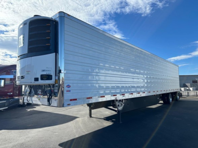 Utility 3000R trailer with large cooler unit at front showing refrigerated body and landing gear, side view.