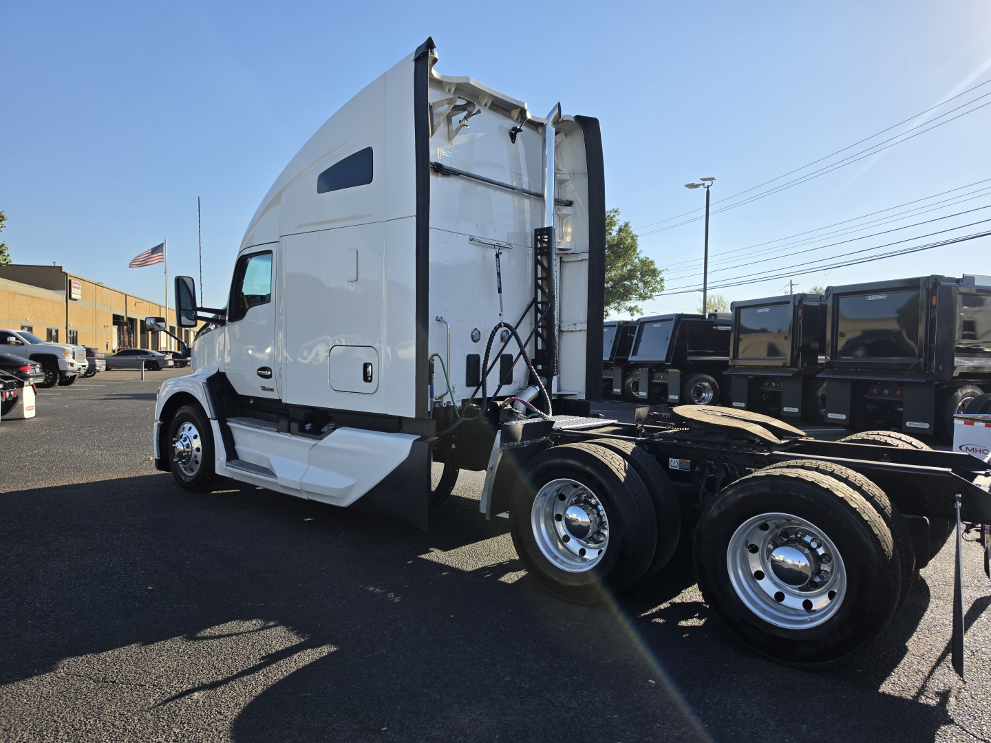 Kenworth T680 tractor side view showing cab, sleeper, and rear wheel axles with chassis and fifth wheel.