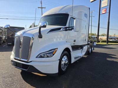 Kenworth T680 conventional sleeper truck in white, front-left view with large grille and sleeper cab.