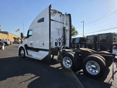 Kenworth T680 tractor side view showing cab, sleeper, and rear wheel axles with chassis and fifth wheel.