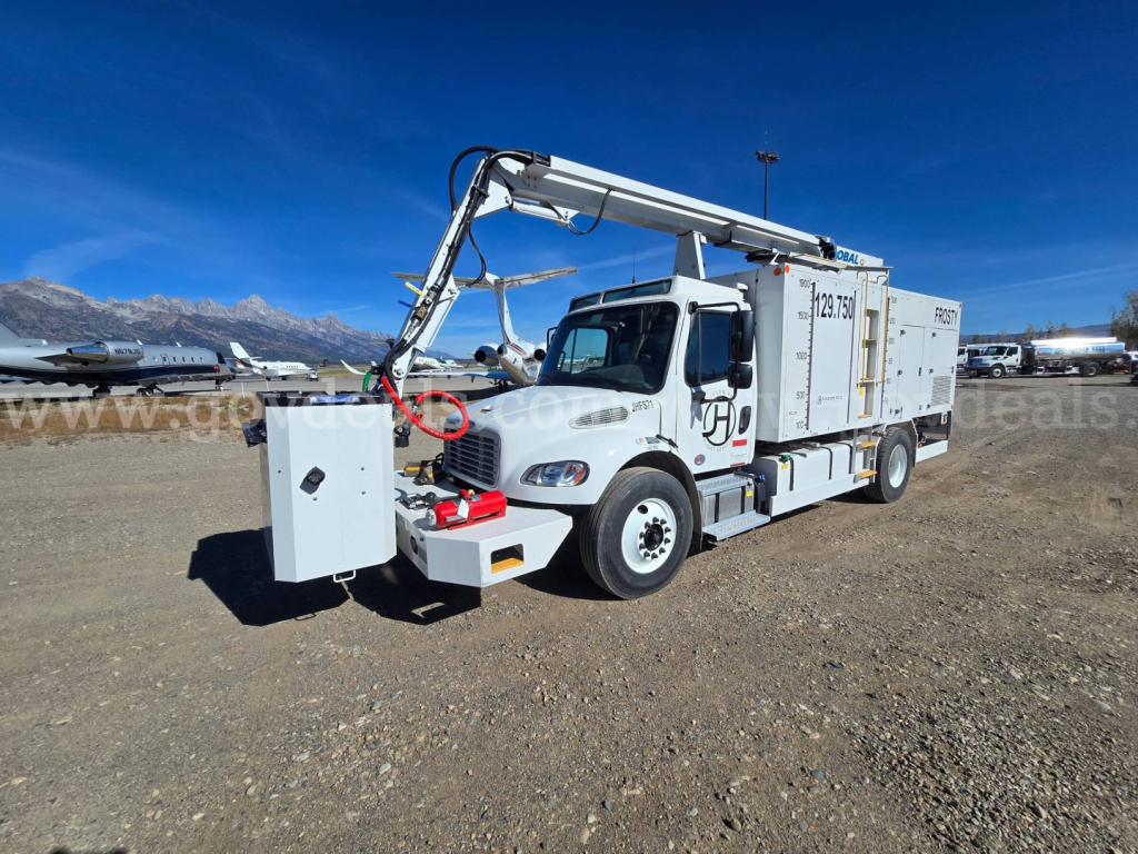 Freightliner 2200SEB utility truck with hydraulic crane, front-mounted control box, and service body, in a dirt lot.