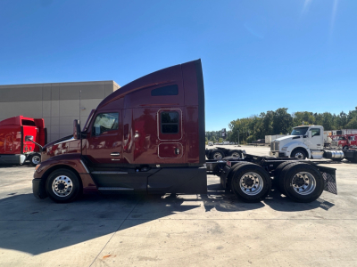 Kenworth T680 tractor cab side profile in burgundy, chassis behind with dual rear axles, stock number 0632214.