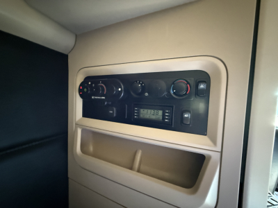 Kenworth T680 interior cab dash panel showing radio and climate controls.
