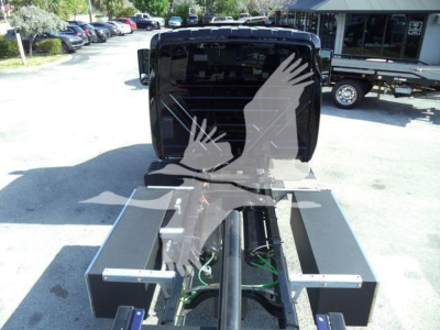 TruckRollback chassis and cab block showing service hitch area with hydraulic lines and mounting brackets.