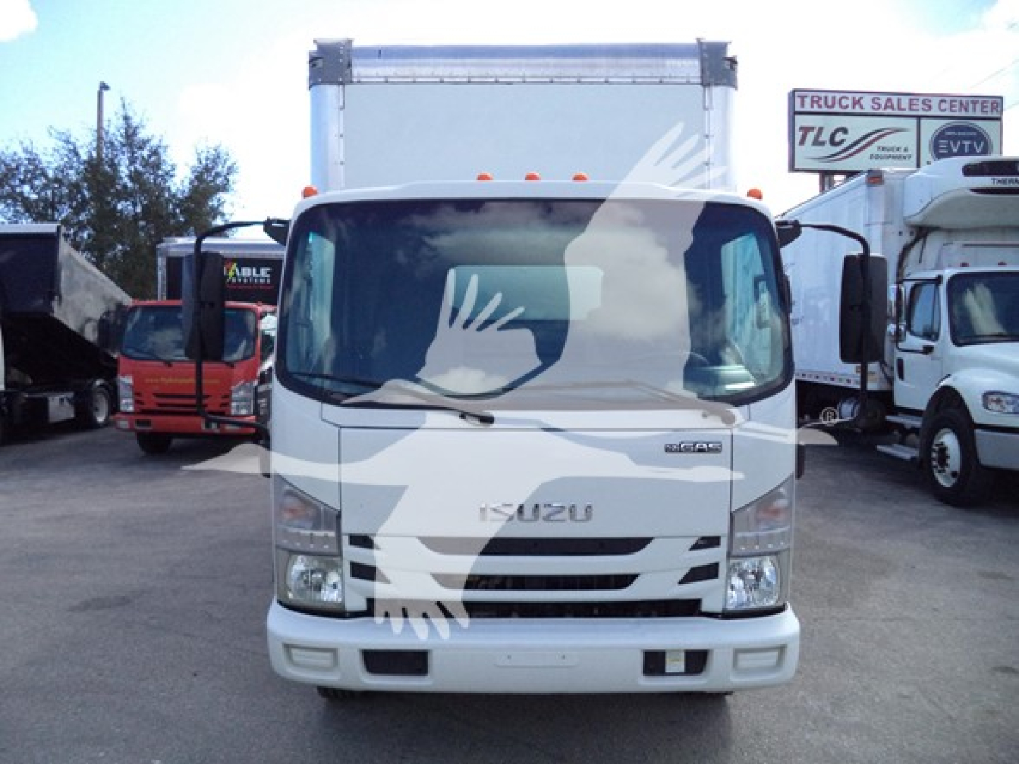 Isuzu NPR-HD box truck front view showing cab and cargo box with Isuzu emblem on grille.
