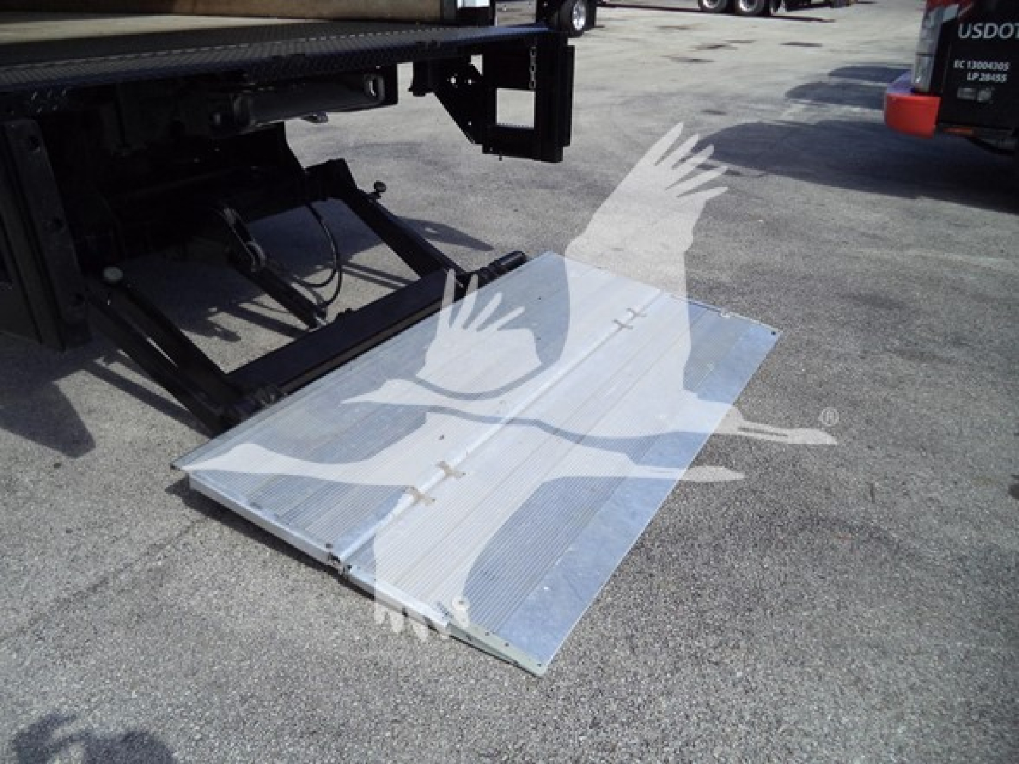 Isuzu NPR HD truck rear with lowered aluminum ramp/step, used condition.