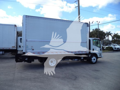 Isuzu NPR-HD box truck viewed in side profile with cargo box and cab, light color, dealership lot background.