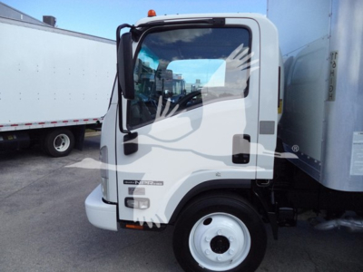 Isuzu NPR-HD box truck cab with white exterior, door badge and side mirrors visible; window reflects hands.