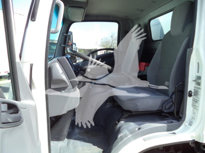 Isuzu NPR HD truck cab interior with front seat and dashboard visible.