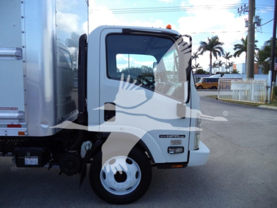 Isuzu NPR HD box truck cab side showing NP truck badge and wheel.