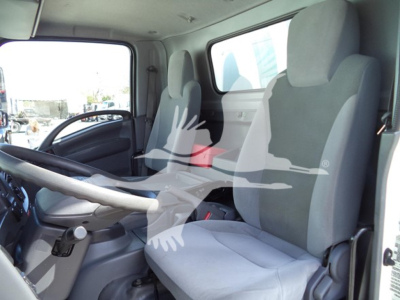 Cab view of a 2020 Isuzu NPR HD box truck showing driver and passenger seats, dashboard, steering wheel.