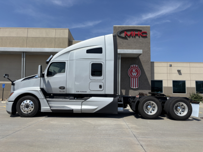 Kenworth T680 truck side view showing cab and chassis with KW logo on the rear panel.