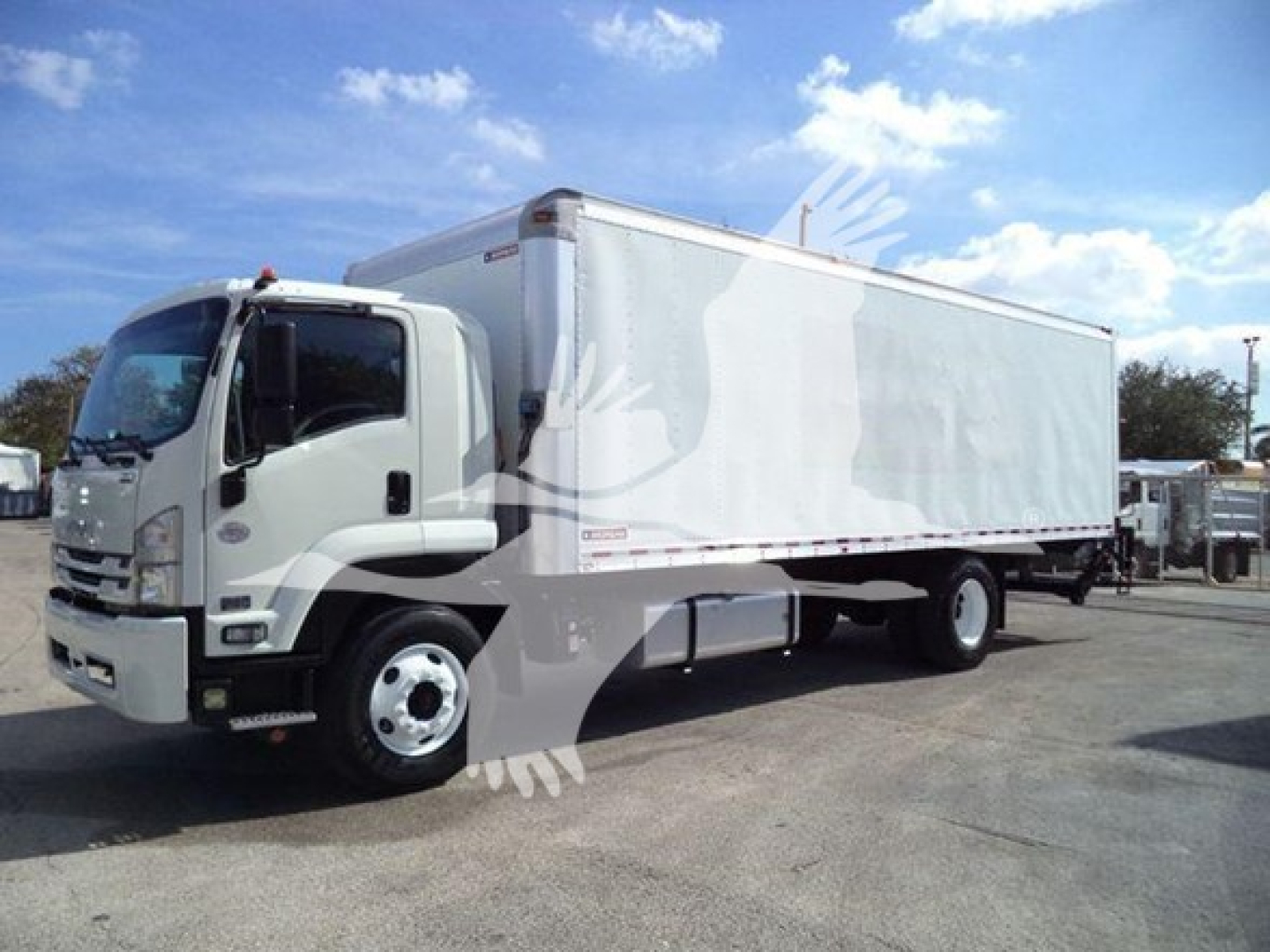 Isuzu FTR box truck in profile view showing cargo box and cab.