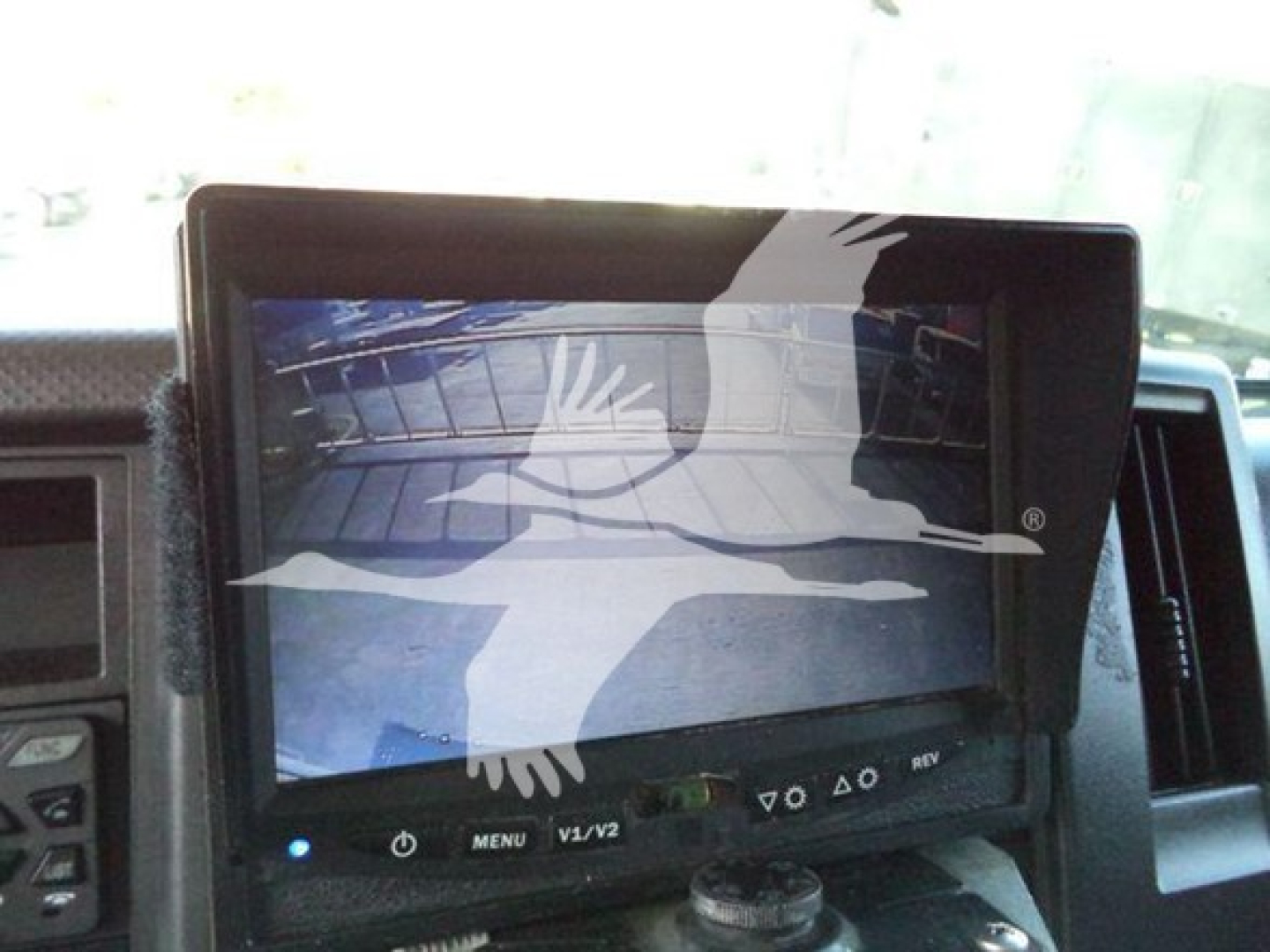 Isuzu FTR dashboard/monitor showing navigation system and controls.