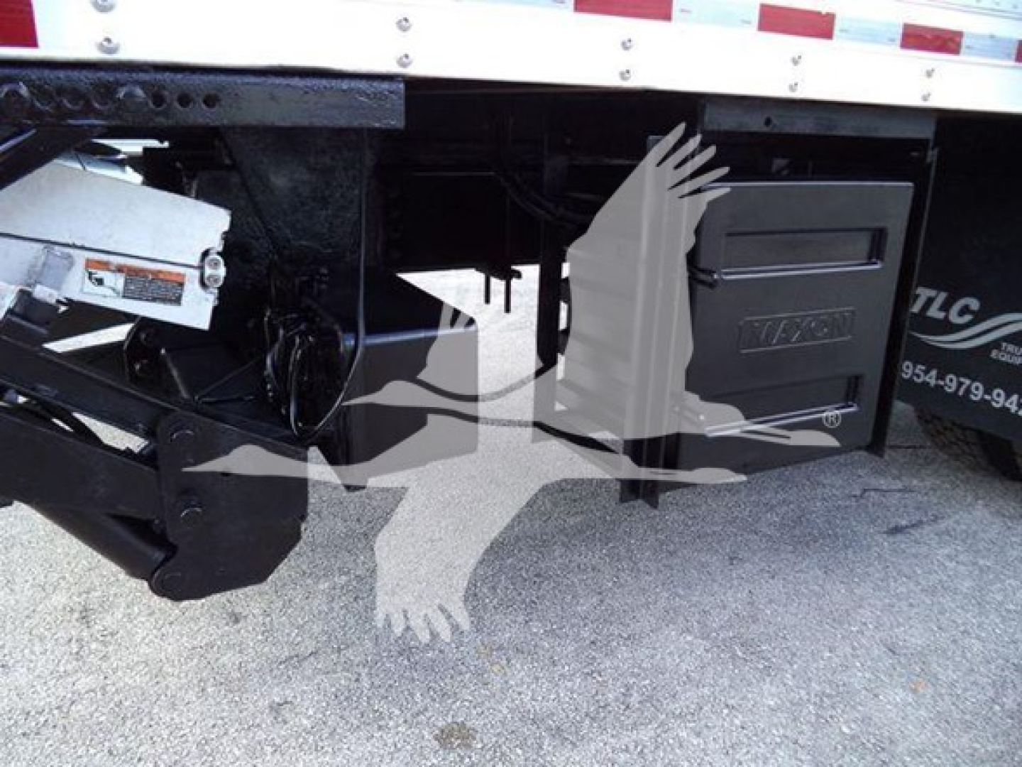 Isuzu FTR truck side view showing toolbox and chassis components.