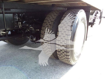 Isuzu FTR truck undercarriage showing dual rear tires and suspension components