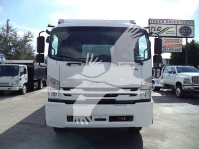 Isuzu box truck front view showing cab with windshield, headlights, and grille. Overlay watermark of a dove. No visible text on the truck itself.