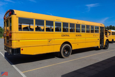 School bus in yellow with black windows. Side text reads CENTRAL SCHOOL. Rear shows small lettering and taillights. Exterior appears clean with standard school-bus body and wheels.
