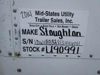 Trailer side showing white label with handwritten and printed text: '2014 Mid-States Utility Trailer Sales, Inc.' and 'S/N IDW... STOCK # U90991'