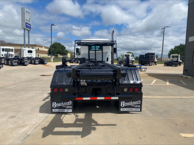 Kenworth T880 rear view showing rollover truck bed and mudflaps with Bruckner's Oklahoma City signage.